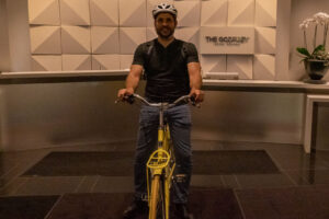 Brian Cicioni on bicycle at Godfrey Hotel Boston