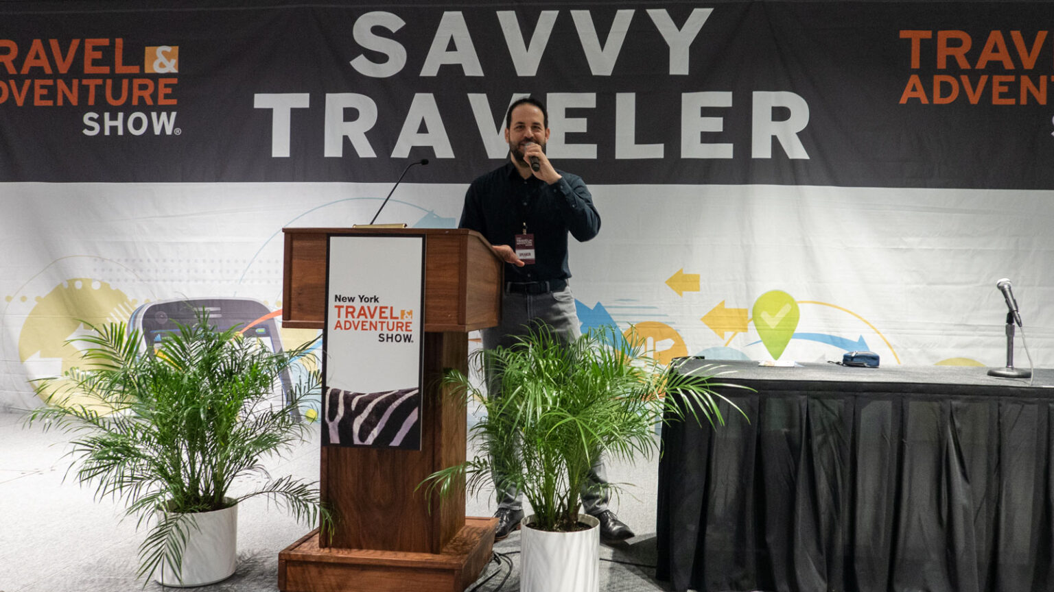 I Ll Be Speaking At The 2024 New York Travel Adventure Show I May Roam   Brian On Stage Savvy Traveler Theater 2023 New York Travel Adventure Show 1600x900 1 1536x864 